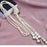 "Strings of Pearls" Double-Knotted Long Pearl Tassel Necklace